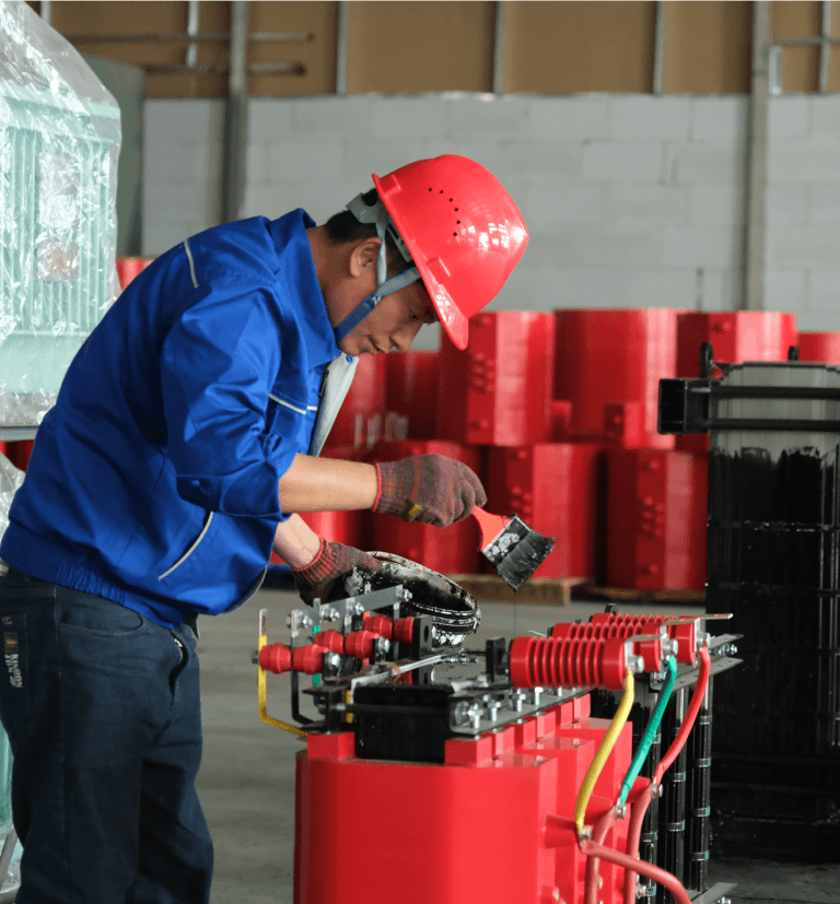 Baitong Electric factory: An experienced worker is carefully assembling the coil of a cast resin dry type transformer.