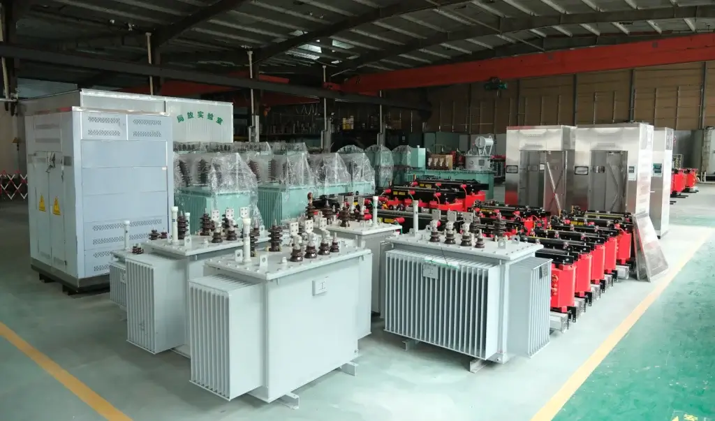Baitong Electric factory floor in Yueqing, China, showing diverse wholesale inventory including oil-immersed transformers, dry-type transformers, and substation enclosures.