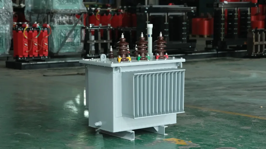 A newly assembled 35kV oil-immersed transformer featuring a corrugated cooling tank and high-voltage bushings, stationed on the Baitong Electric workshop floor for routine testing.