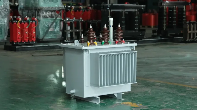 A newly assembled 35kV oil-immersed transformer featuring a corrugated cooling tank and high-voltage bushings, stationed on the Baitong Electric workshop floor for routine testing.