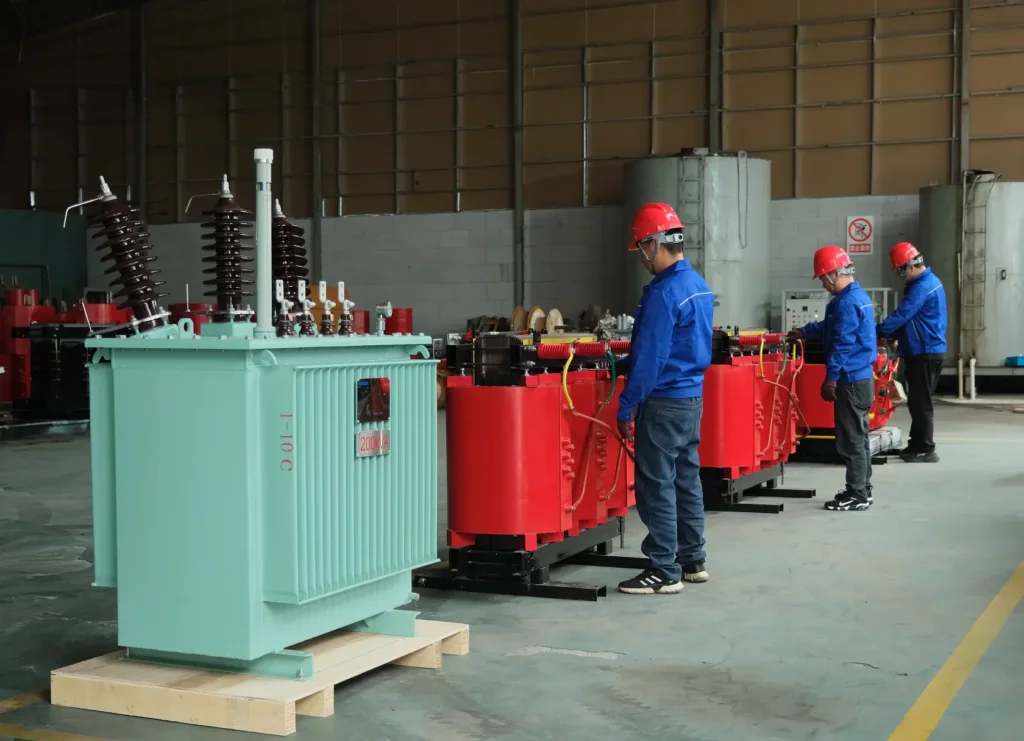 Baitong Electric worker assembling iron cores for cast resin dry type distribution transformers in a certified manufacturing facility.