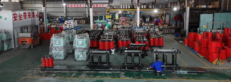 A wide panoramic view of the Baitong Electric factory floor showing massive dual production lines for both dry-type and liquid-filled transformers.