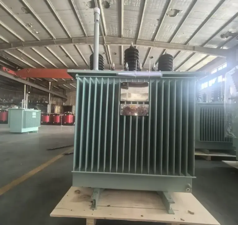 A fully assembled premium oil immersed distribution transformer on a wooden shipping pallet ready for global export on the Baitong Electric factory floor.