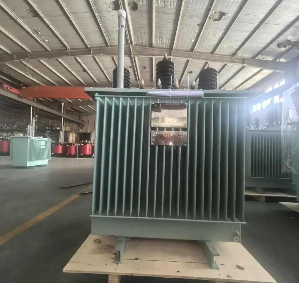 A fully assembled premium oil immersed distribution transformer on a wooden shipping pallet ready for global export on the Baitong Electric factory floor.