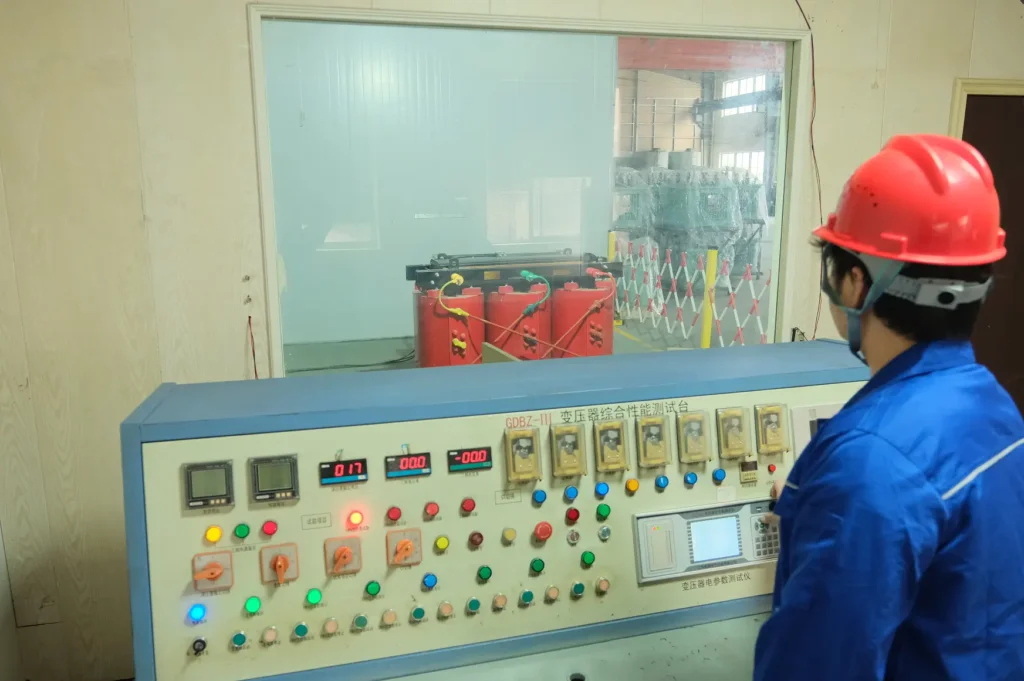 A Baitong Electric engineer conducting strict transformer factory testing on a cast resin unit using a comprehensive performance test bench behind safety glass.