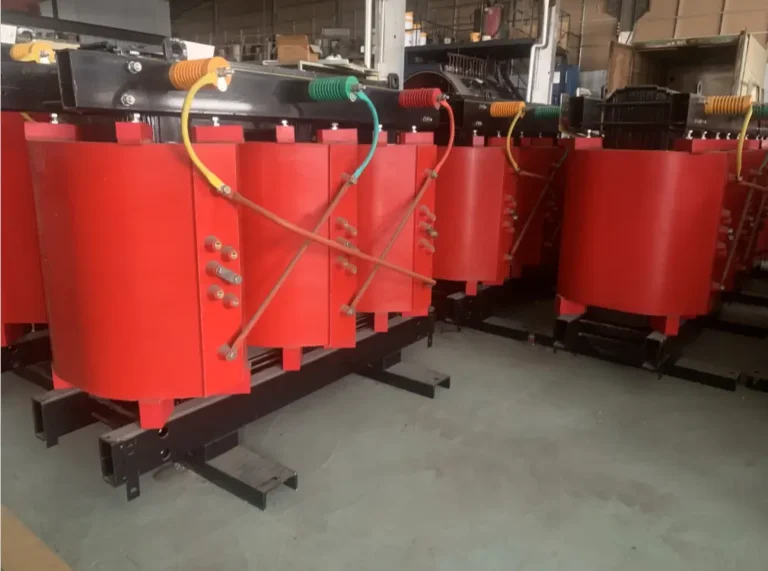 Red resin dry type transformer coil assemblies in the Baitong Electric workshop